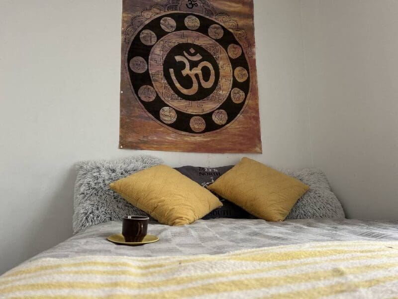 Cozy bedroom at Yogi Living retreat center in the Swedish countryside of Skåne.