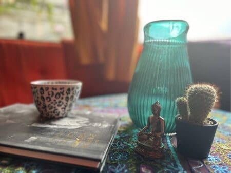 Warm and inviting Boho Caravan at Yogi Living Retreat Center in Sweden, with red and orange tones, perfect for relaxation and inspiration