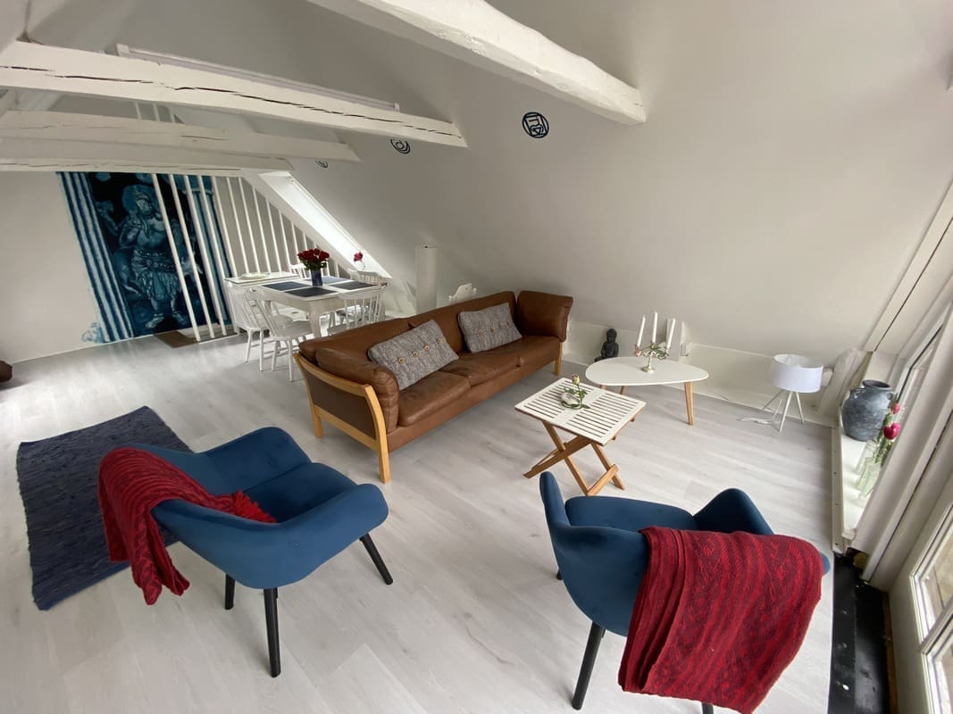 Bright and serene living room at Yogi Living Guesthouse in Skåne, Sweden, designed for relaxation and comfort