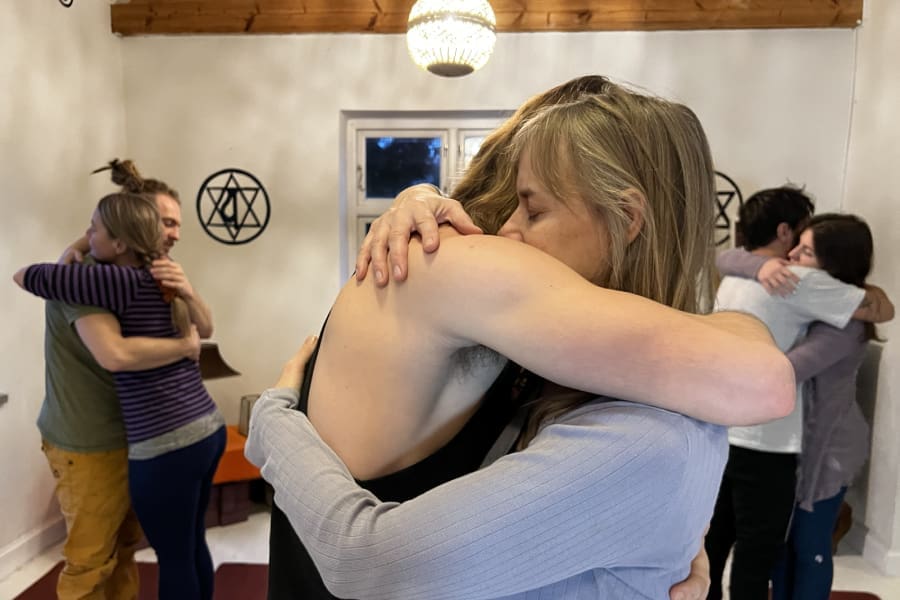 Group embracing with love and joy during the Kundalini Tantra Yoga Retreat in Sweden, sharing heart-opening energy