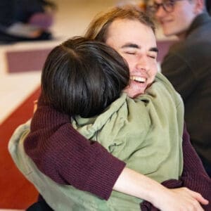 Smiling couples practicing yoga together at a couples yoga retreat in Sweden