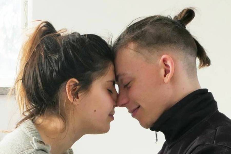 Couple in deep intimate connection during Tantra retreat in Sweden, experiencing sacred love and trust.