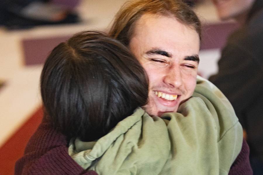 Couples sharing joyful tantric hug during Tantra retreat in Sweden, embodying love and happiness.